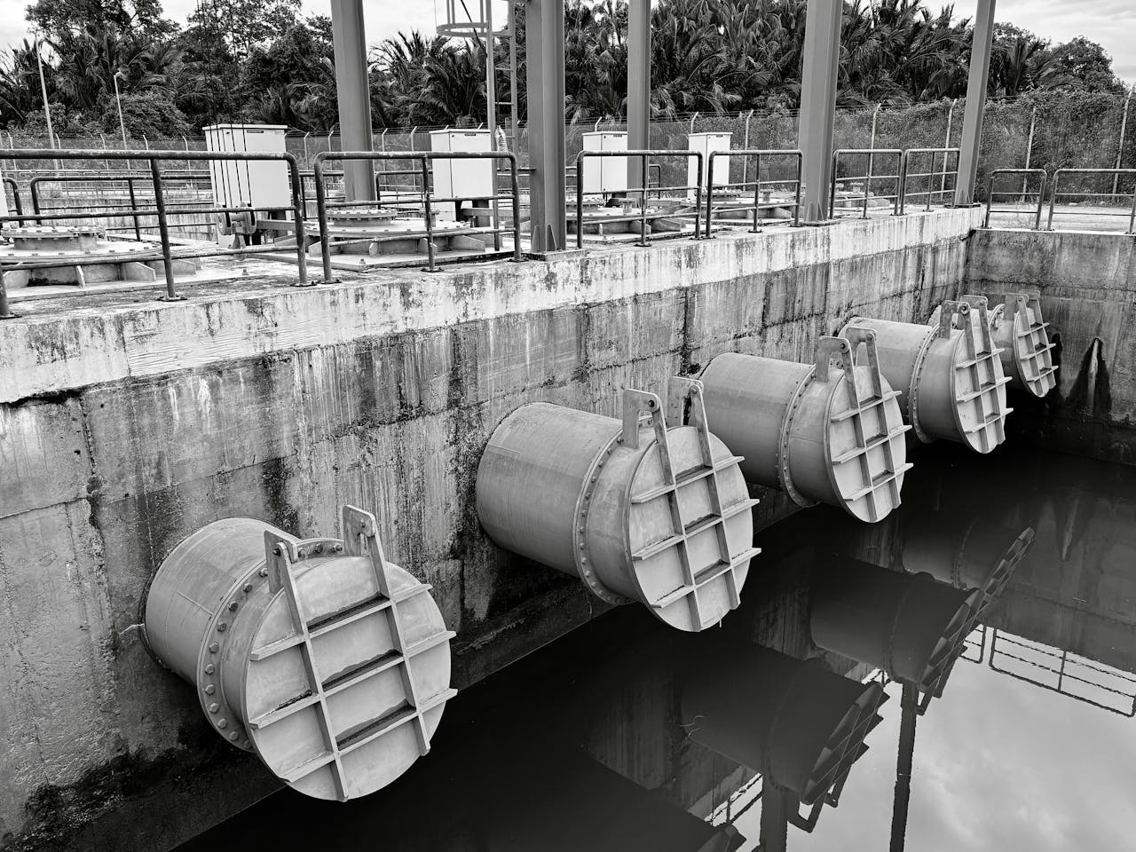 Crafting Captivating Headlines: Your awesome post title goes here Monochrome image of large industrial water pipes with valves.